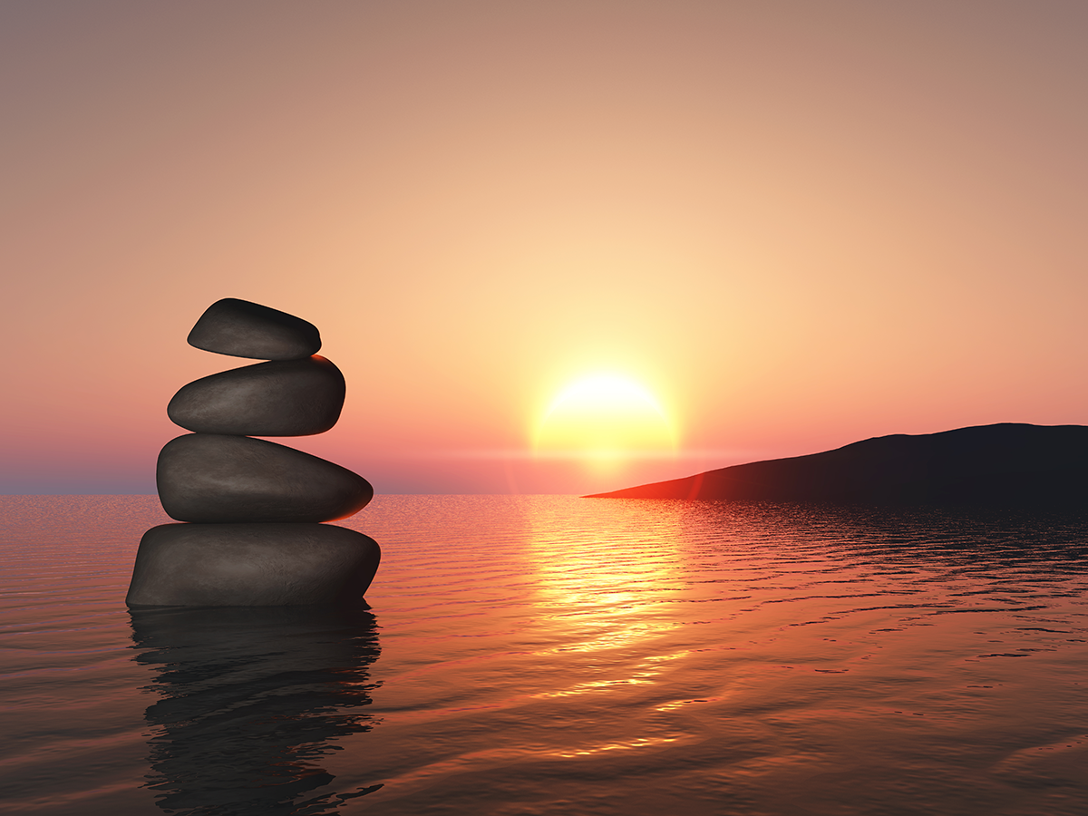 Balancing pebbles and calm water